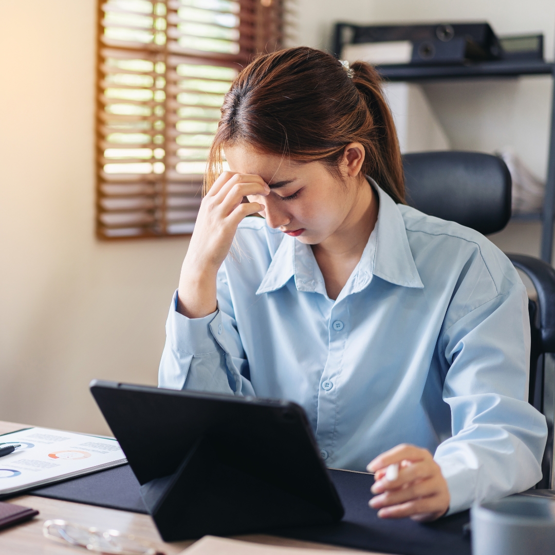 Employee feeling stressed at desk